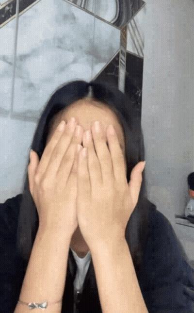 Woman Covering Face With Hands Wearing Bracelet GIF