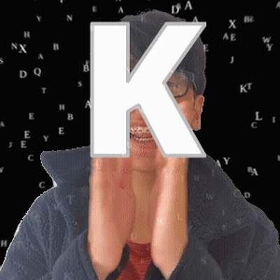 Woman Covering Face With Letter K GIF
