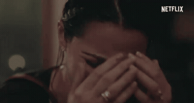 Woman Covering Face With Netflix Logo GIF