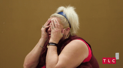 Woman Covering Face With TLC Logo GIF