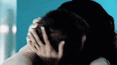 Woman Covering Man's Face With Hands GIF