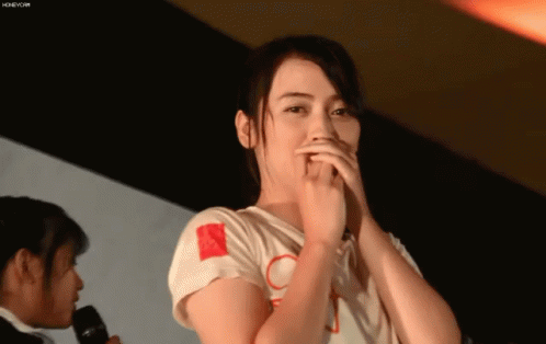 Woman Covering Mouth At Table GIF