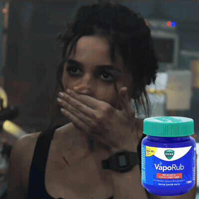 Woman Covering Mouth Beside VapoRub Bottle GIF