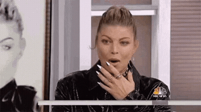 Woman Covering Mouth By Window GIF