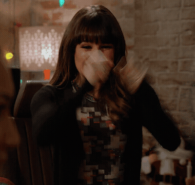 Woman Covering Mouth In Black Sweater GIF