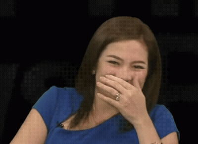 Woman Covering Mouth In Blue Shirt GIF