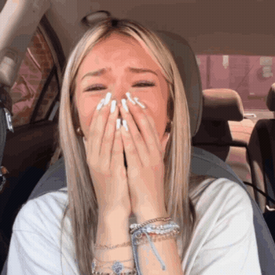 Woman Covering Mouth In Car GIF