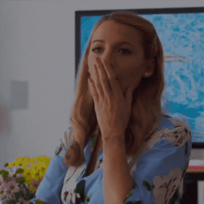 Woman Covering Mouth In Front Of TV GIF