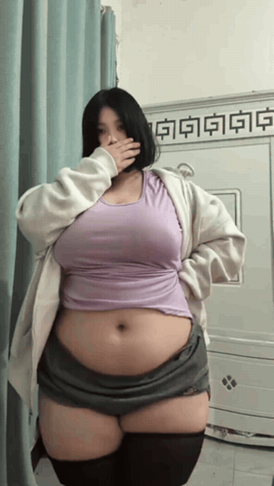 Woman Covering Mouth In Purple Top GIF