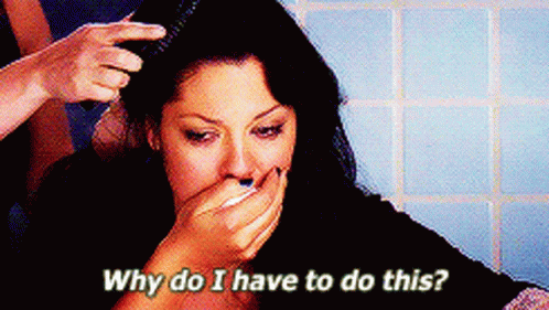 Woman Covering Mouth While Hair Brushed Saying Why Do I Have To Do This GIF