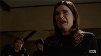 Woman Covering Mouth While Man Looks On GIF