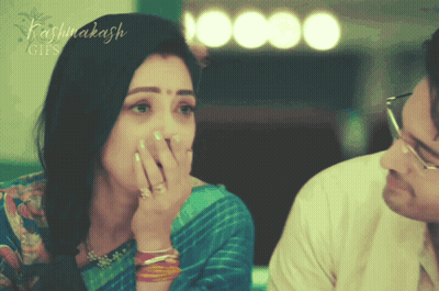 Woman Covering Mouth While Man Looks On With Name Kashinakash GIF
