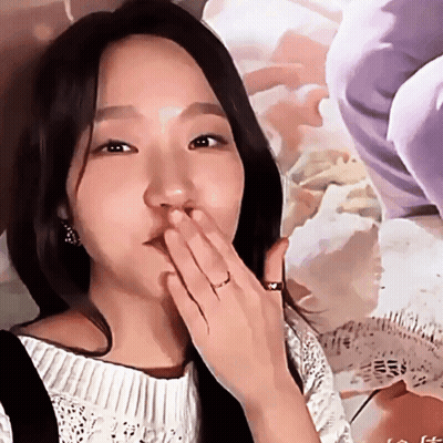 Woman Covering Mouth With Ring GIF