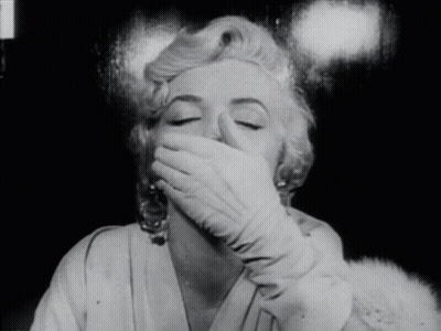 Woman Covering Mouth With White Gloves GIF