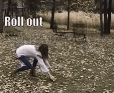 Woman Crawling Through Leaves With Shovel GIF