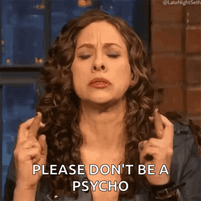 Woman Crossing Fingers Making Face GIF