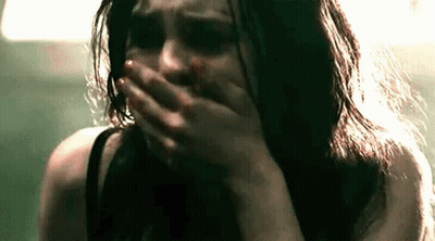 Woman Crying Blood On Face Covering Mouth GIF