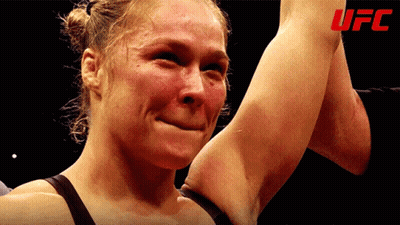 Woman Crying Holding Arm Up UFC Logo GIF