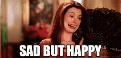 Woman Crying Holding Fan Sad But Happy GIF