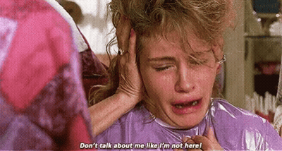 Woman Crying Holding Head While Another Listens GIF
