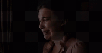 Woman Crying In Dark Room Looking Out Window GIF