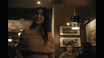 Woman Crying In Dark Room With Man At Table GIF