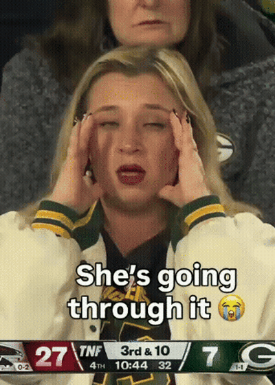 Woman Crying In Front Of Green Bay Packers Game GIF