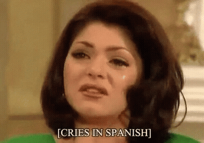 Woman Crying In Spanish In Green Shirt And Green Sweater GIF