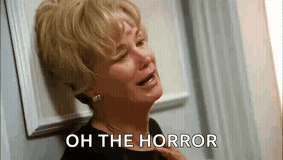 Woman Crying Leaning Against Wall Oh The Horror GIF