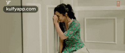 Woman Crying With Head In Hands On Bed GIF