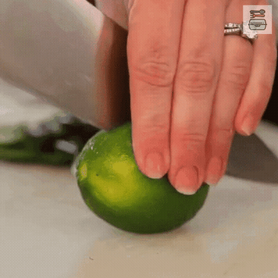Woman Cutting Lime With Knife GIF