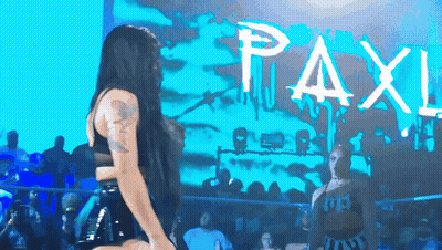 Woman Dances By Sign Saying Paxl GIF
