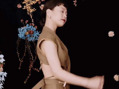Woman Dancing Among Flowers GIF