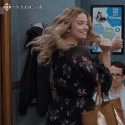 Woman Dancing By Know Your Pets Medications Sign GIF
