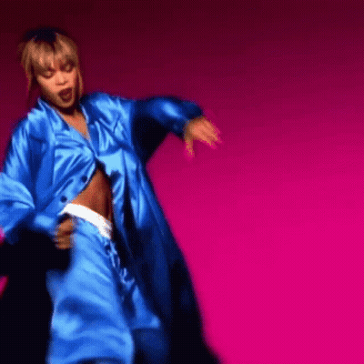Woman Dancing In Blue Outfit On Pink Background GIF