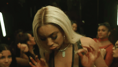 Woman Dancing In Club With Group GIF