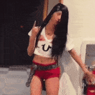 Woman Dancing In Crop Top And Shorts GIF