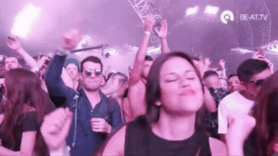 Woman Dancing In Crowd At Music Festival GIF