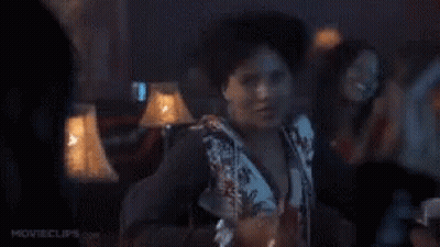 Woman Dancing In Dark Room Holding Drink GIF