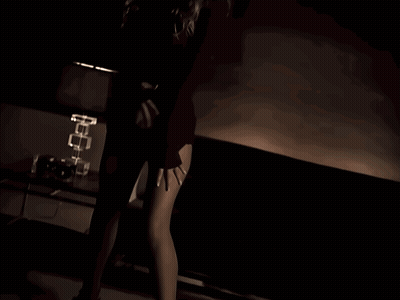 Woman Dancing In Dark Room With Lamp GIF
