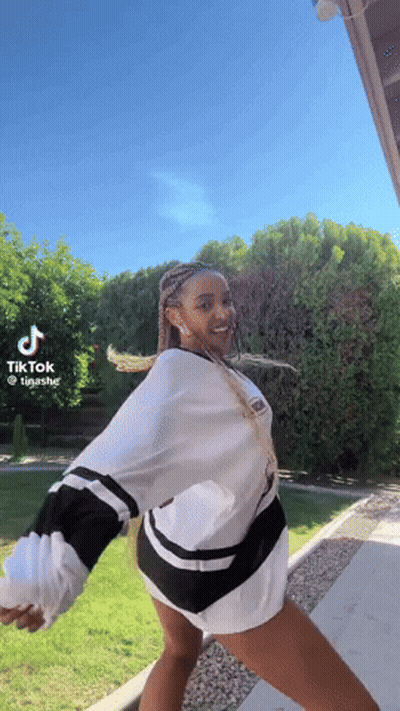 Woman Dancing In Front Of Blue Sky Tik Tok GIF