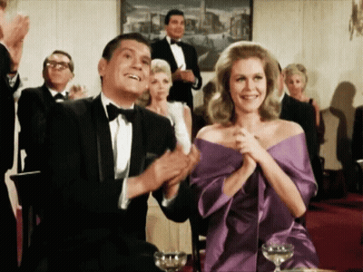 Woman Dancing In Front Of Brick Wall And Gold Throne GIF