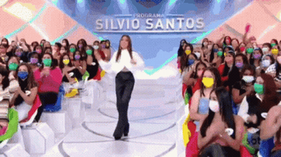 Woman Dancing In Front Of Crowd Wearing Face Masks GIF