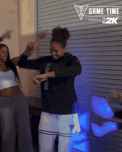 Woman Dancing In Front Of Game Time Sign GIF