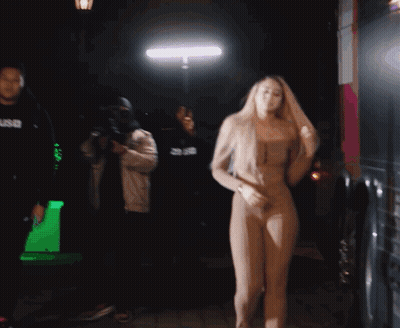 Woman Dancing In Front Of Man In SNB Hoodie GIF