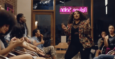 Woman Dancing In Front Of Neon Sign Saying Ndb2 GIF