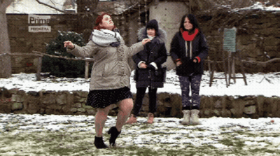 Woman Dancing In Front Of Prima Premiera Sign GIF