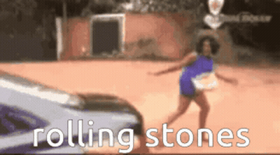 Woman Dancing In Front Of Rolling Stones Car GIF