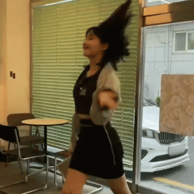 Woman Dancing In Front Of Window With Blinds GIF