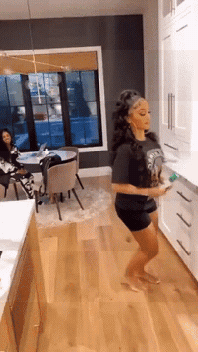 Woman Dancing In Kitchen Holding Cleaning Sponge GIF